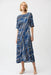 Woman wearing Joseph Ribkoff stripe print fit and flare dress for office outfit