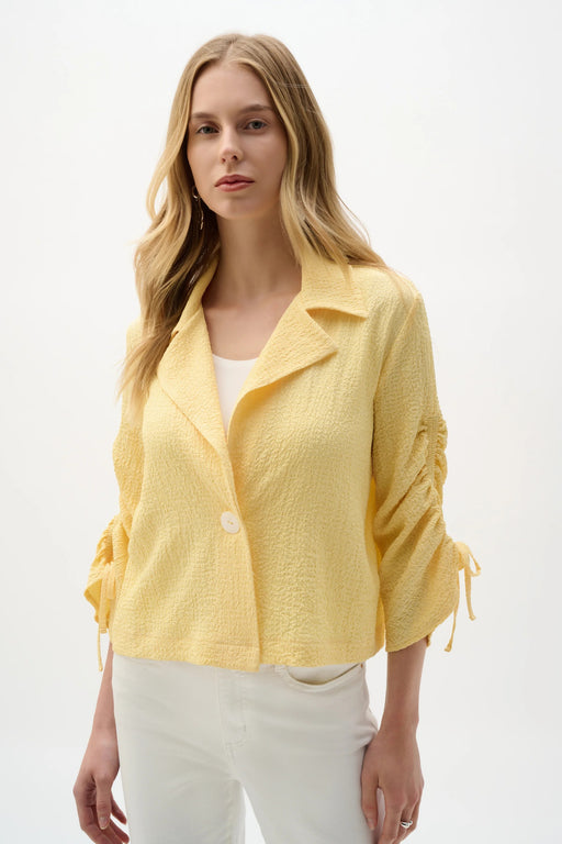 Woman wearing Joseph Ribkoff boxy blazer with shirred sleeves styled for office wear, business casual looks, layering, and modern tailored outfits.