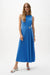 Woman wearing a sleeveless trapeze midi dress with side buckle detail in black and blue, styled for a modern elegant look