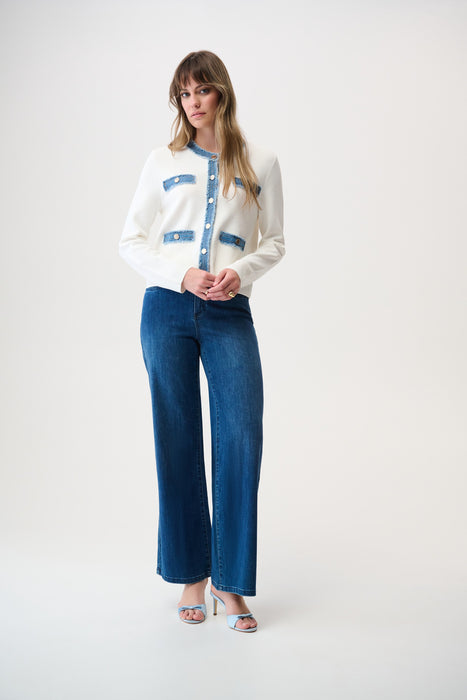 Woman wearing Joseph Ribkoff button closure casual jacket with contrast trim, featuring structured fit, decorative pockets, and chic modern styling paired with denim.