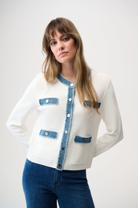 Woman wearing a white button front jacket with contrast denim trim on the edges and long sleeves from Joseph Ribkoff