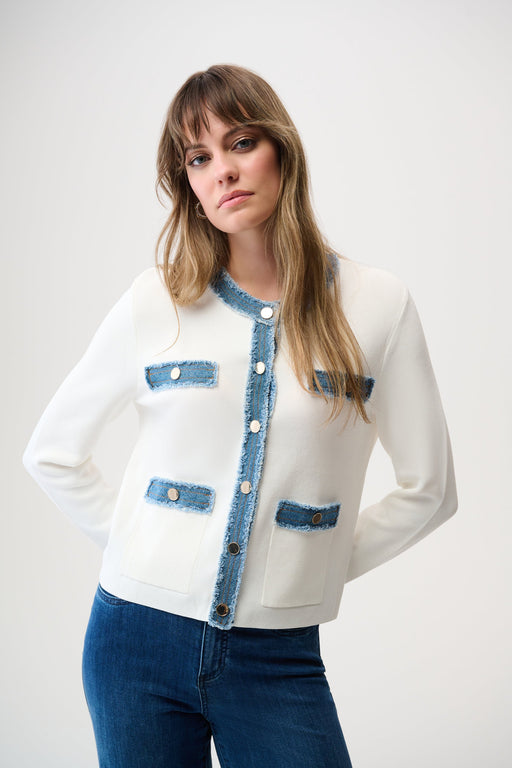 Woman wearing a white button front jacket with contrast denim trim on the edges and long sleeves from Joseph Ribkoff