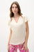 Woman wearing Joseph Ribkoff canvas butterfly sleeves top styled for office chic, brunch, casual outings, and elegant evening occasions.