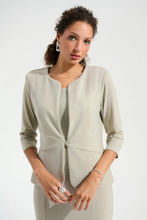 Woman wearing a sparky beige matching tank and jacket from Joseph RIbkoff