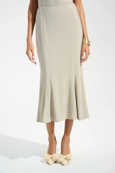 Woman wearing a sparkly beige trumpet skirt with high waist and midi length from Joseph Ribkoff