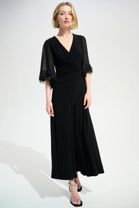 Woman wearing blue chiffon sleeve wide leg jumpsuit with wide leg silhouette and elegant evening style