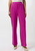 Woman wearing a fuchsia trouser pants with pleated front and wide leg