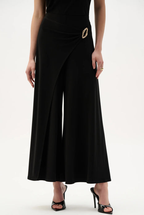 Woman wearing designer wide leg pants for chic outfit styling
