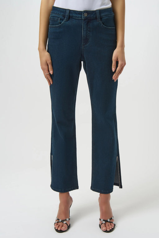 Woman wearing a dark blue denim straight jean with rhinestone-trimmed side split hem