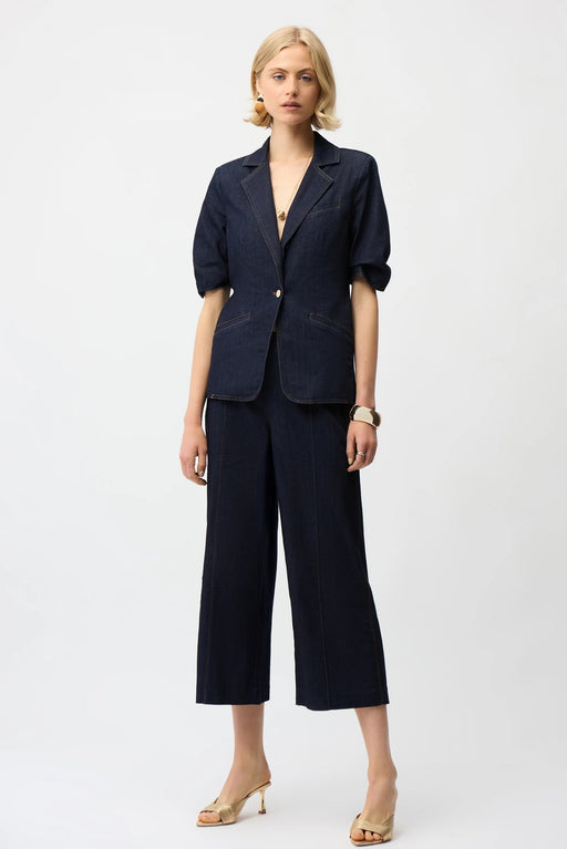 Woman wearing a dark blue jeans in dark wash denim with cropped wide leg from Joseph Ribkoff
