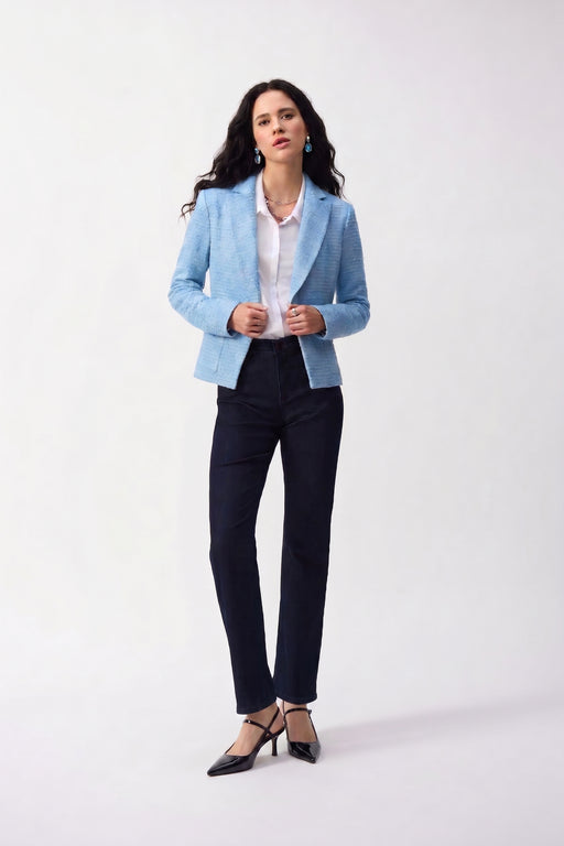 Woman wearing classic bootcut stretch jeans styled with a casual chic outfit, perfect for travel, weekend outings, everyday wear, or relaxed office settings.