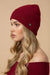 Woman wearing red sequined knitted beanie from Joseph Ribkoff