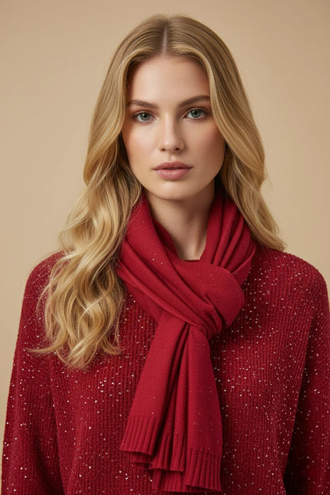 Woman wearing red knit scarf with tone-on-tone sequins from Joseph Ribkoff