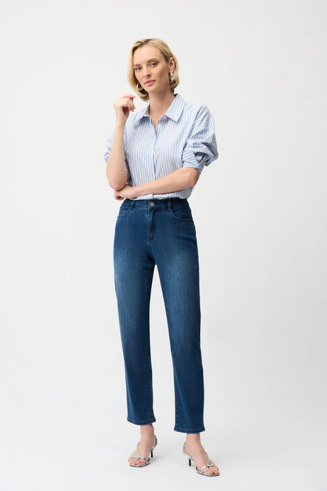 Woman wearing Joseph Ribkoff Classic Slim Fit Stretch Jeans in Featherweave™ denim styled with a blouse and heels for a polished casual-chic look.