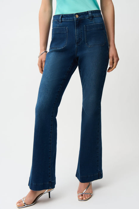 Woman wearing a medium wash blue denim jeans with front patch pockets and flared leg from Joseph Ribkoff