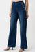 Woman wearing wide-leg pull-on denim jeans with sailor-inspired button details, styled for casual chic outfits, travel, weekend outings, or elevated everyday wear.