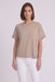 A woman modeling a short-sleeve, crew-neck taupe-beige top from Joseph Ribkoff