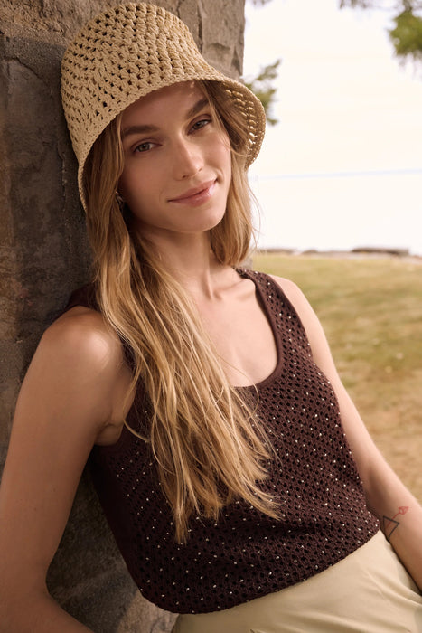 Woman wearing Joseph Ribkoff embellished knit camisole top with rhinestone detail styled for evening wear, parties, date nights, and elegant casual looks.