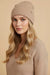 Woman wearing beige sequined knitted beanie from Joseph Ribkoff