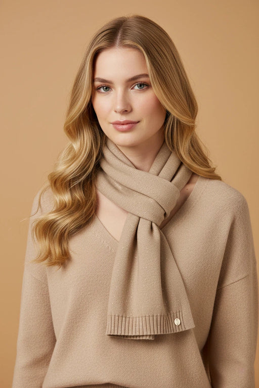 Woman wearing beige knit scarf with tone-on-tone sequins from Joseph Ribkoff