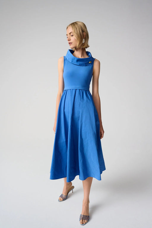 Woman wearing Joseph Ribkoff fit and flare shawl collar dress in midi length with sleeveless design and elegant structured silhouette in blue and black options.