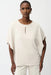 Woman wearing Joseph Ribkoff front keyhole poncho top styled for elegant casual wear, office chic, resort vacation, and evening dinner occasions.