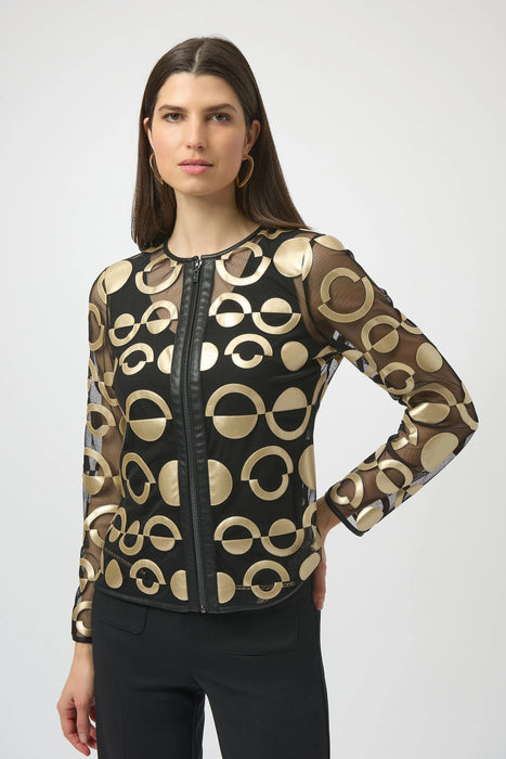 Woman wearing a black mesh jacket with gold leatherette geometric pattern