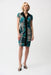 Woman wearing a green and black geometric striped sheath dress with zip front and cap sleeves from Joseph Ribkoff