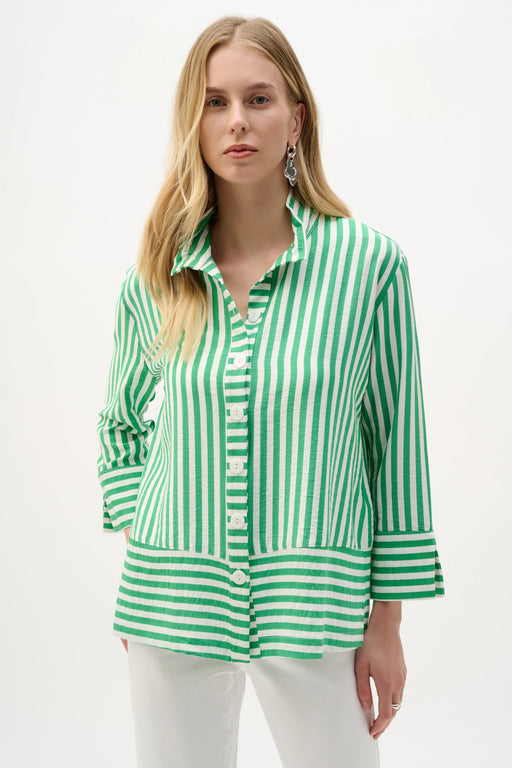 Woman wearing a green and vanilla stripe print straight jacket with a button-front design and relaxed fit, styled for a fresh and modern look.