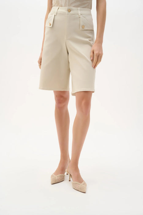 Woman wearing Joseph Ribkoff Repreve denim Bermuda shorts for casual summer outfit