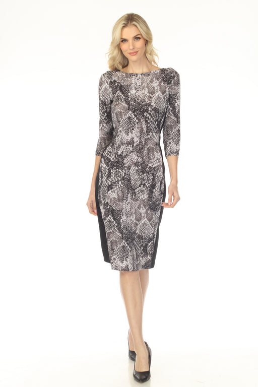 Woman wearing a snakeskin patterned knee-length sheath dress from Joseph Ribkoff