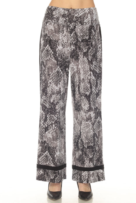 Woman wearing a snakeskin printed wide leg pant with black trim from Joseph Ribkoff