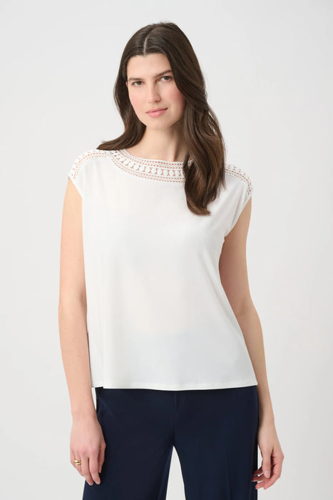 Woman wearing Joseph Ribkoff silky knit guipure neckline straight top styled for office wear, evening outings, elegant casual looks, and special occasions.