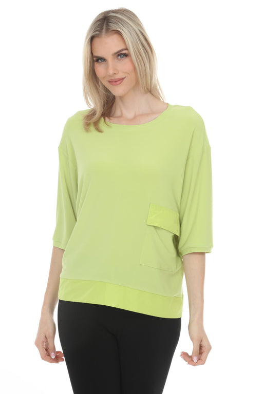 Woman wearing Joseph Ribkoff tunic top for chic office and casual outfit
