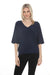 Woman wearing Joseph Ribkoff boxy V-neck top for elegant office outfit