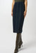 Woman wearing a dark denim jean midi skirt with vertical stitch details