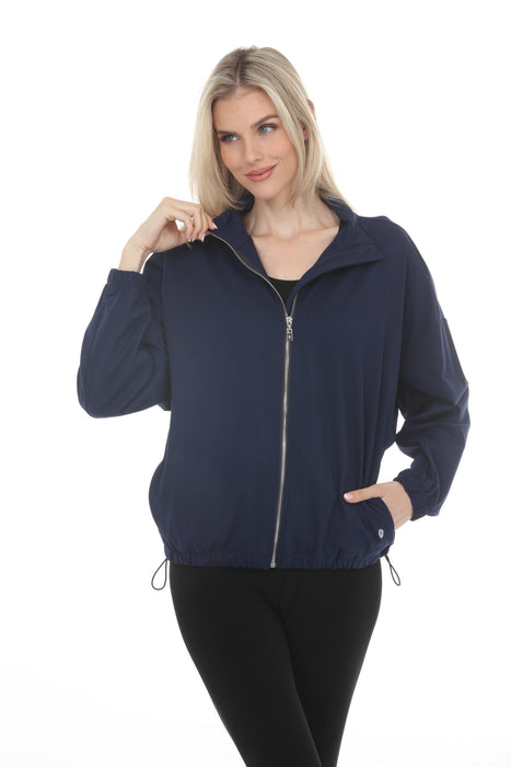Woman wearing Joseph Ribkoff sporty bomber jacket for chic travel outfit
