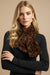 Woman wearing a leopard print faux fur scarf from Joseph Ribkoff