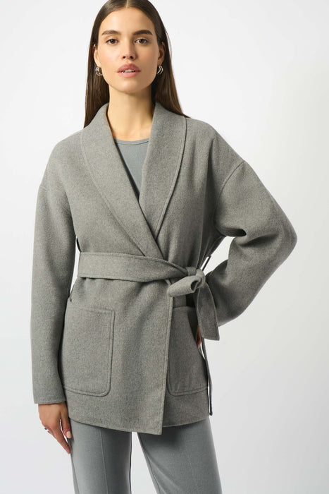 Woman wearing a gray wrap kimono coat with belt and front pockets