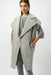 Woman wearing a light gray feather yarn boxy sweater vest from Joseph Ribkoff