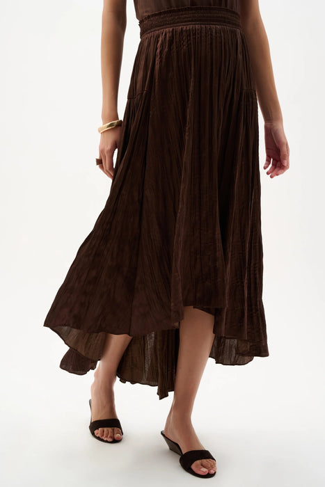 Woman wearing Joseph Ribkoff mahogany pleated satin flare skirt styled for evening dinner, resort vacation, date night, and elegant special occasions.