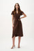Woman wearing a mahogany wrap dress with ruffled sleeves and gold buckle detail, styled in an elegant midi silhouette for a sophisticated look