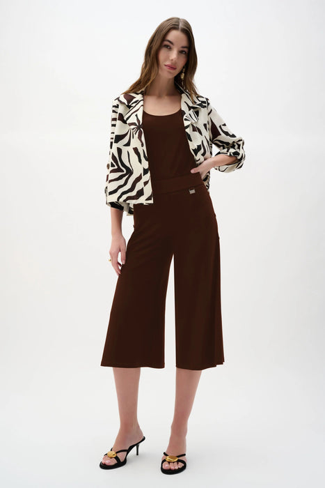 Woman wearing a brown Joseph Ribkoff silky knit culotte pants for elegant office outfit