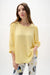Woman wearing Joseph Ribkoff puff sleeves trapeze top, featuring a flowy silhouette, voluminous sleeves, lightweight fabric, and an elegant, modern fit.