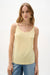 Woman wearing Joseph Ribkoff silky knit fitted camisole tank top styled for layering under blazers, sheer tops, and casual chic summer outfits.