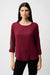 Woman wearing a burgundy lightweight blouse with contrasting rhinestone embellishments on the 3/4 sleeves