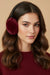 Woman wearing red faux fur earmuffs from Joseph Ribkoff