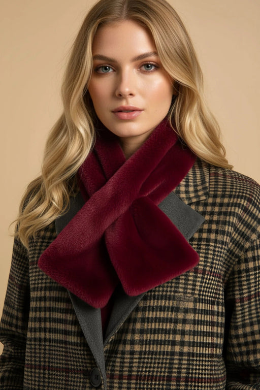Woman wearing a red faux fur pull through scarf from Joseph Ribkoff
