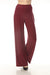 Woman wearing red high rise wide leg pants from Joseph Ribkoff