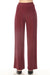 Woman wearing red high rise wide leg pants from Joseph Ribkoff